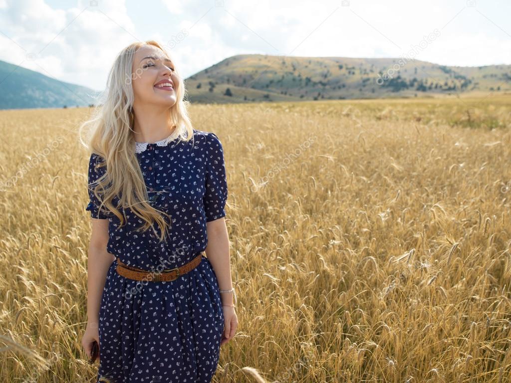 Romantic girl in a field