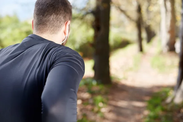 Runner doing stretching outside in autumn — Stock Photo, Image