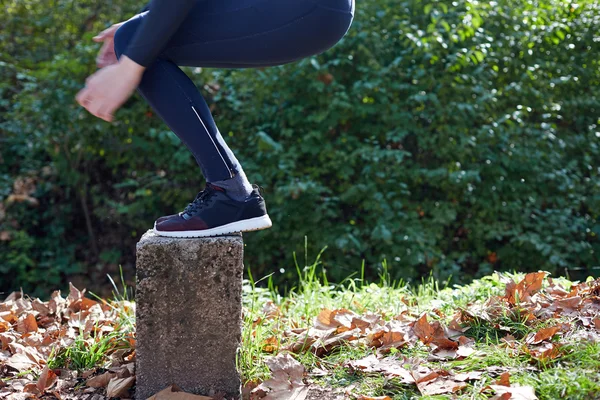 Runner doing stretching outside in autumn — Stock Photo, Image