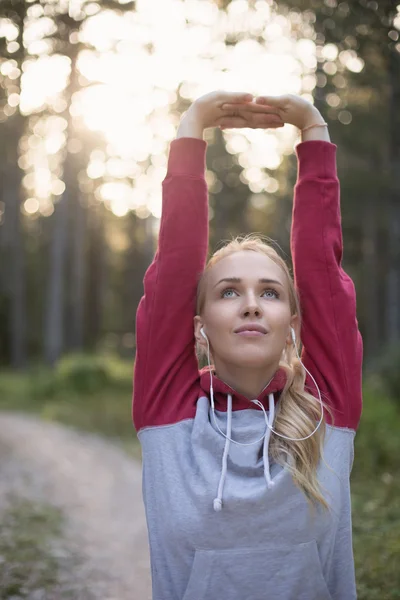 Portrait of female runner in nature after jogging — Stock Photo, Image