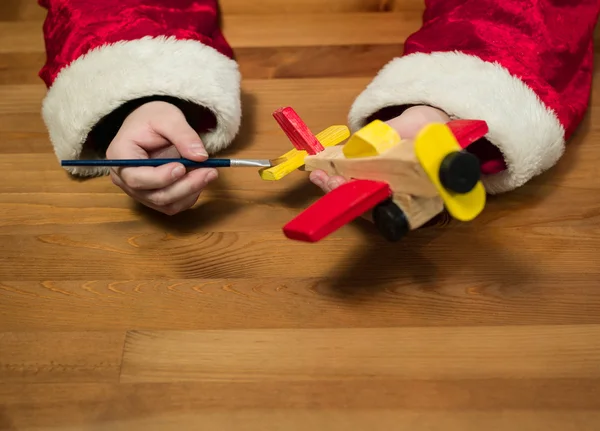 Santa Claus Sitting His Workshop Painting Toy Airplane Horizontal Composition — Stock Photo, Image