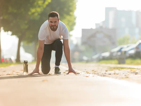 Running and jogging exercising concept. Man tying laces before t — Stock Photo, Image