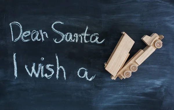 Dear Santa is written on a blackboard and christmas gift — Stock Photo, Image