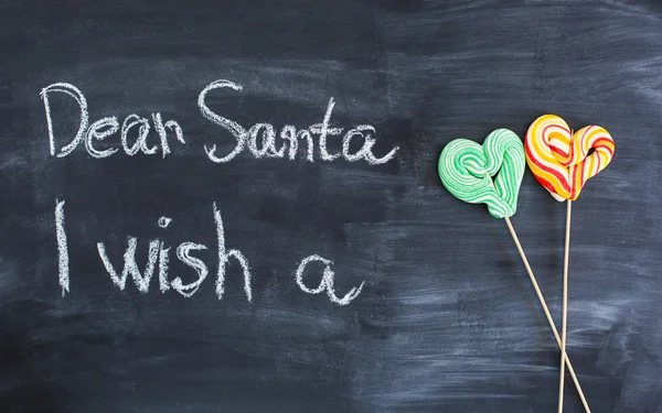 Dear Santa is written on a blackboard and christmas gift — Stock Photo, Image