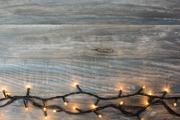 Fondo de Navidad. madera de tablón con luces y spa de texto libre —  Fotos de Stock