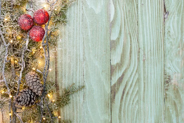 Christmas fir tree with decoration on a wooden board — Stock Photo, Image