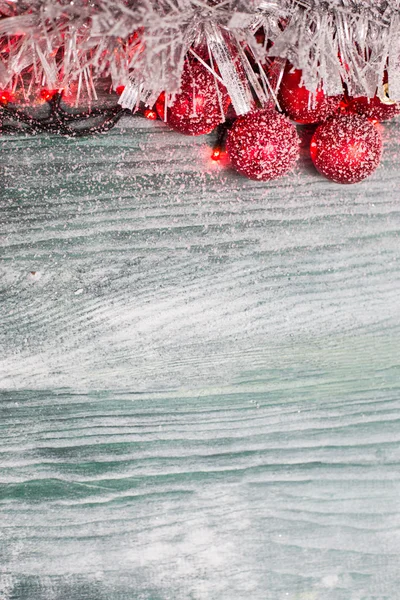 Snowflake Christmas Ornaments with fir greens against Rustic Whi — Stock Photo, Image