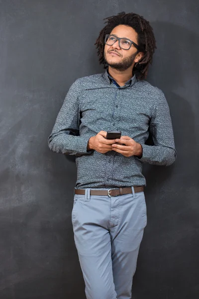 Typing message. Handsome young hipster with afro hair in casual — Stock Photo, Image