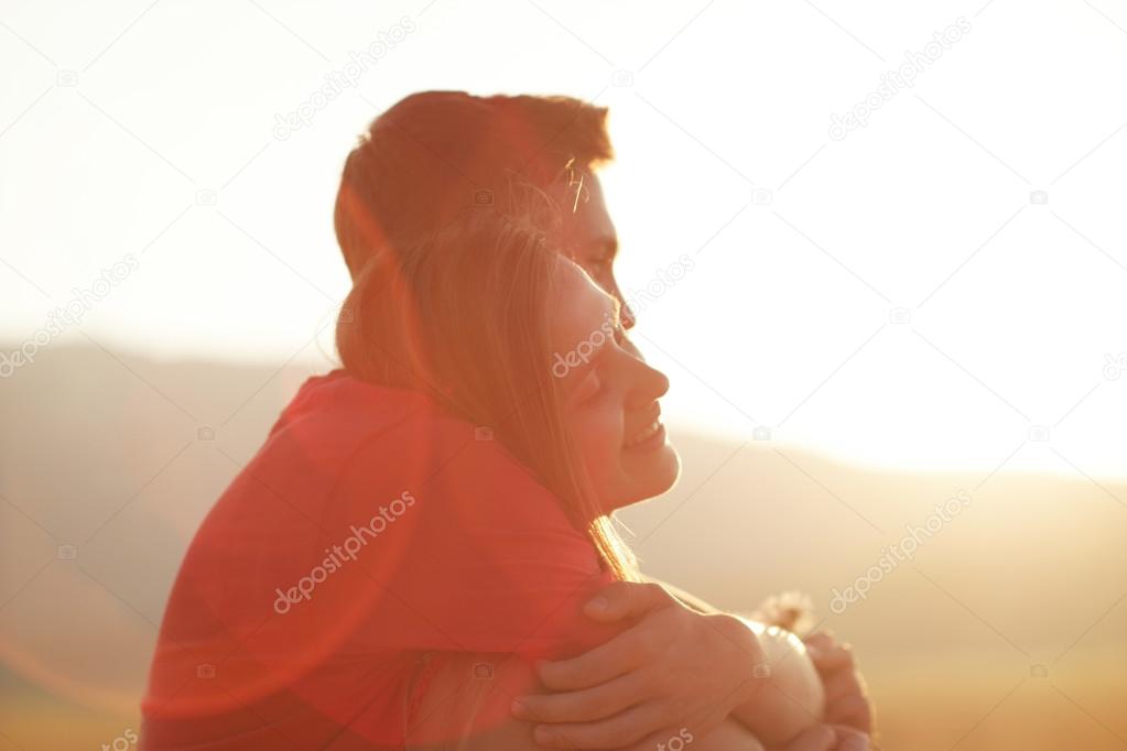 silhouette of a loving couple at sunset