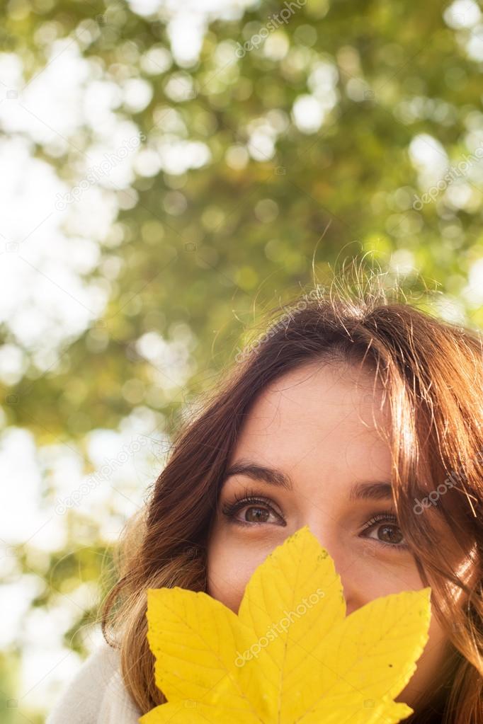 Autumn model, bright make up. woman on background fall landscape