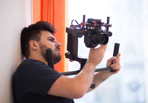 Professional videographer with gimball video slr