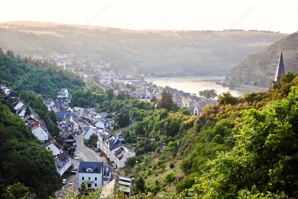 Hazy sunset view from Schnburg (Auf Schoenburg), a castle above the medieval town of Oberwesel in the UNESCO World Heritage site of the Upper Middle Rhine Valley, Rhineland-Palatinate, Germany. 