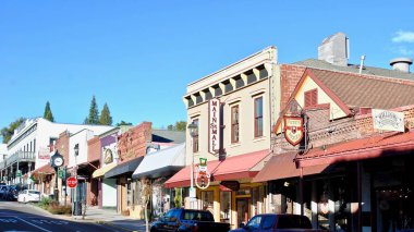 Grass Valley, California, USA: Main Street with Pete's Pizza, Main St Mall, Sierra Star, and Holbrooke Hotel. Grass Valley is a Gold Rush town in the foothills of the Sierra Nevada mountains.  clipart