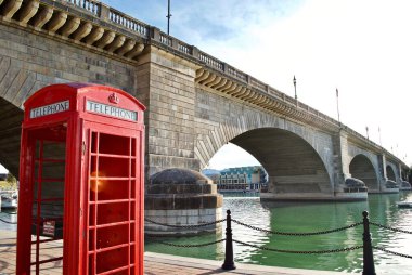 Lake Havasu City, Arizona: An iconic English red phone booth and the London Bridge. The bridge was purchased from London and reconstructed in Arizona in 1971 to bring tourism to the area.  clipart