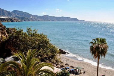 Nerja, Spain - View from the Balcony of Europe (Balcn of Europa) on the Costa del Sol. Calahonda beach, the rocky outcrops, El Chorrillo beach and unobstructed views of the Maro-Cerro Gordo coastline