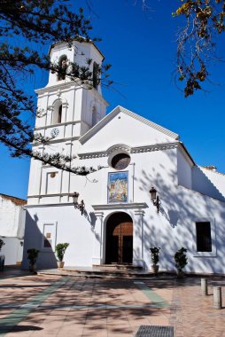 The picturesque 17th century Church of El Salvador  Iglesia El Salvador  is situated on the edge of the Balcn de Europa (Balcony of Europe) in Nerja, Spain. White mediterranean Spanish church. 