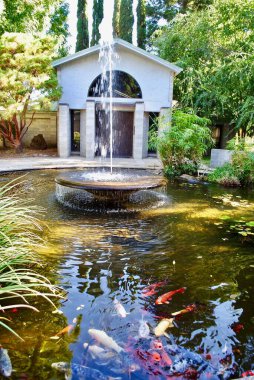 The Abbey of New Clairvaux is a rural Trappist monastery located in Northern California in the small town of Vina in Tehama County. Saint Cecilia's Chapel, koi pond and fountain. clipart
