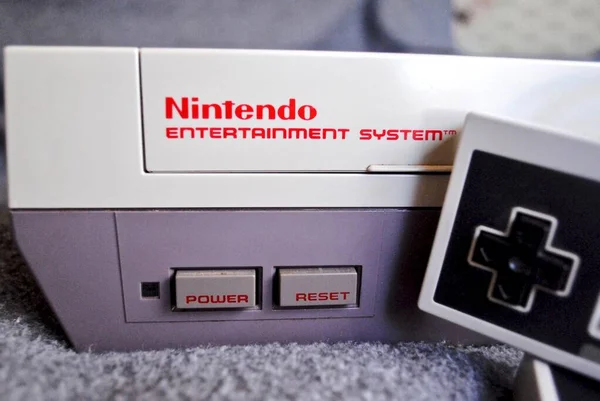 The Nintendo Entertainment System (NES), an 8-bit third-generation home  video game console produced by Nintendo. NES Control Deck home video game  console with controllers. Stock Photo