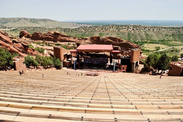 Morrison, Colorado: Red Rocks Amphitheatre is an open-air amphitheatre built into a rock structure in the western United States. Red rocks surround the stage and seating for 9,500. 