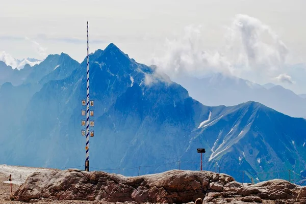 A traditional Bavarian May Pole (German: Maibaum) stands on Germany\'s tallest mountain - Zugspitze. This is called the world\'s highest maypole and is used to celebrate spring each year.