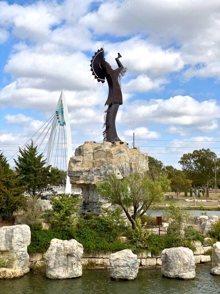 Wichita, Kansas: The Keeper of the Plains is a 44-foot, 5-ton weathered steel sculpture by Kiowa-Comanche artist Blackbear Bosin at the confluence of the Arkansas and Little Arkansas rivers.