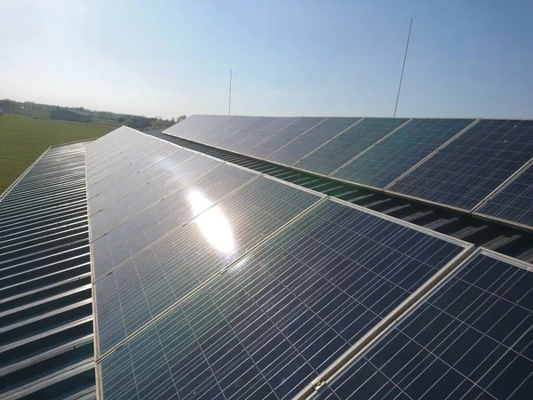 Solar panels on the roof. Sunny day. Clear blue sky.