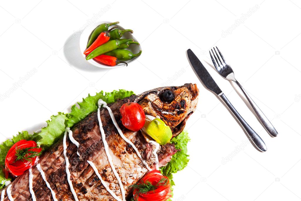 Dish of fried fish with vegetables