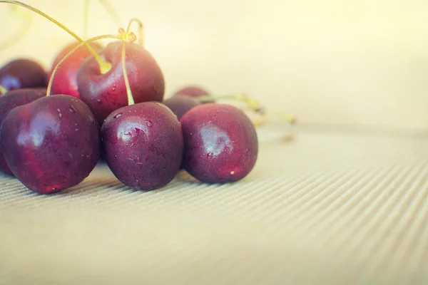 Cherries on wooden table — Stock Photo, Image