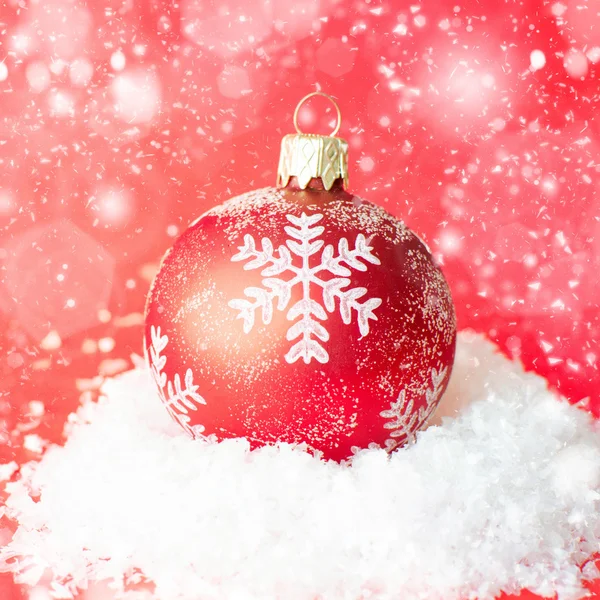 Christmas ball in the snow — Stock Photo, Image