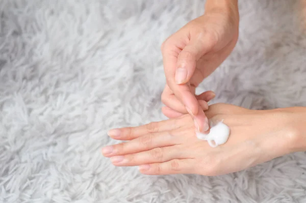 Woman Applying Moisturizing Hand Cream Hand Carpet Background Health Care — Photo