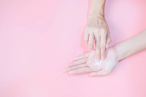 Woman Applying Moisturizing Hand Cream Hand Pink Background Health Care — Photo