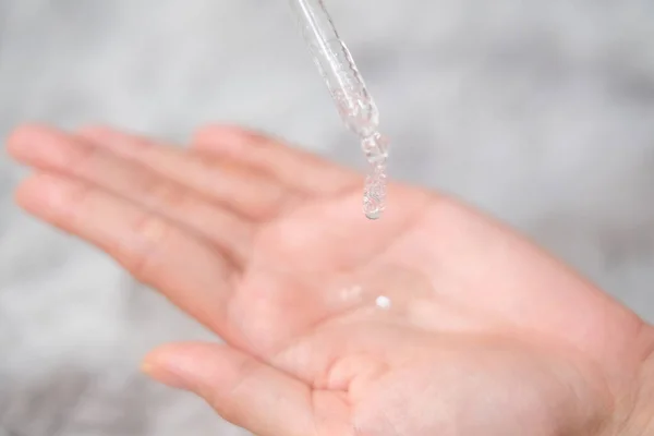 Woman Hands Apply Cosmetic Serum Bottle Using Pipette Carpet Background — Stok fotoğraf