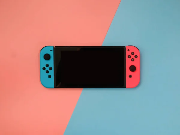 Thailand , Bangkok - APRIL 21, 2021 Nintendo switch on pink and blue background.