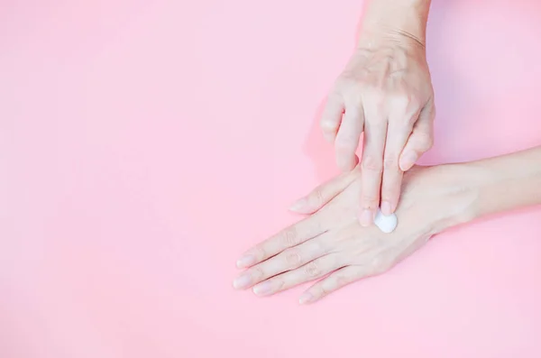 Woman Applying Moisturizing Hand Cream Hand Pink Background Health Care — Photo
