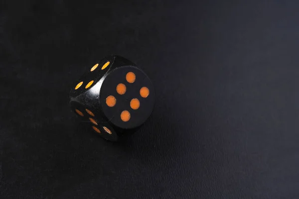 Black Dice Standing Balance Edge Showing Black Table — Stock Photo, Image