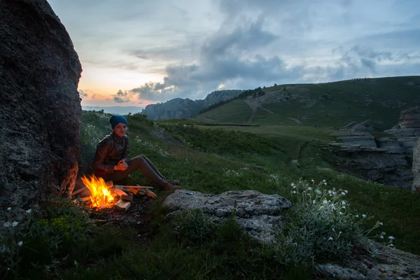 Twilight in the mountains, a fire in a mountain hike