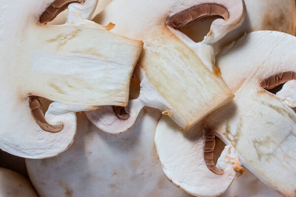 sliced mushrooms champignons close-up concept of food and cooking surface texture