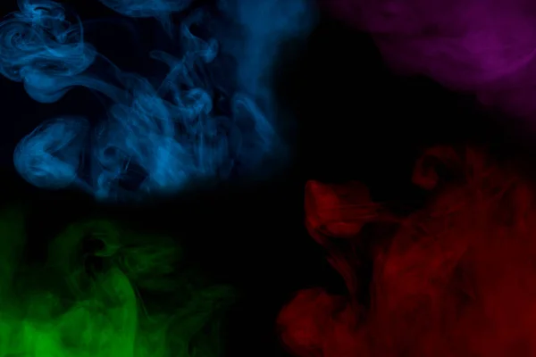 Cuatro Nubes Místicas Humo Cigarrillo Multicolor Cerca Sobre Fondo Oscuro —  Fotos de Stock