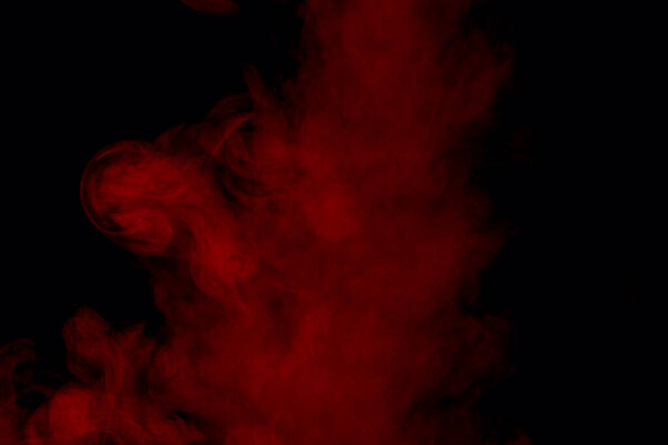 Vertical jet of red cigarette vapor with mysterious patterns beautiful abstraction smoking concept