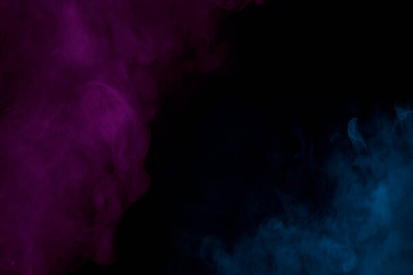 Blue and purple cigarette vapor mystical and charming on a dark background colored smoking concept