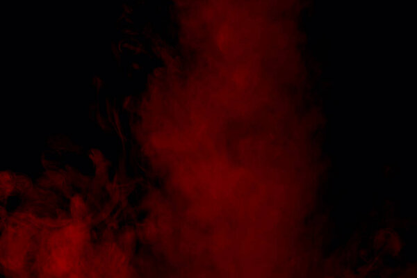 Red exciting steam on a dark background concept of smoking mysterious abstraction
