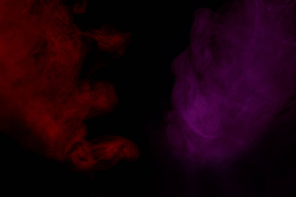 A red cloud of cigarette vapor is like a flame and a purple mysterious and enchanting abstraction for the design color concept of smoking