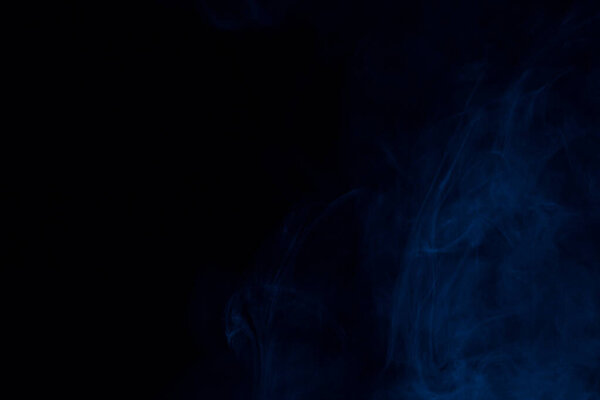 Part of a dark blue cloud of cigarette vapor mysterious abstraction background for design