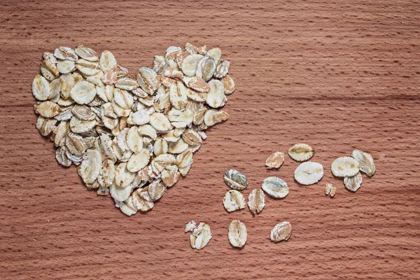 Corazón Avena Una Tabla Madera Concepto Primer Plano Alimentación Saludable — Foto de Stock