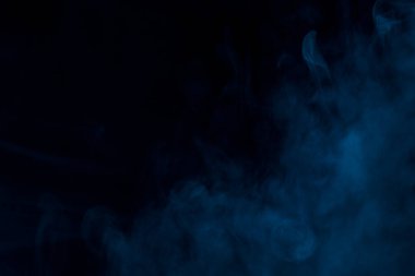 mysterious blue smoke thick and charming on a dark background beautiful abstraction clipart