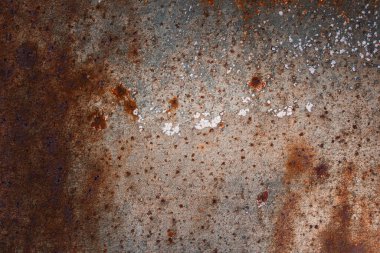 Tasarım için paslı ve gri arkaplanlı güzel ve gizemli metal dokusu