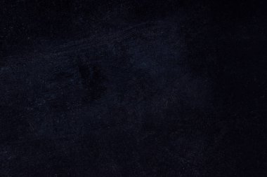 Koyu zımpara kağıdı dokusu tasarım için biraz eski püskü kapatma arkaplanı