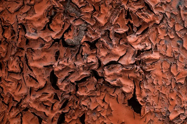 Mistik turuncu boya dokusu koyu çatlaklar yakın plan grunge tasarım için arka plan