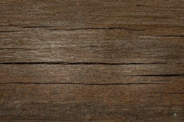 Koyu kahverengi ahşap doku, çatlaklar ve çizikler tasarım için arka plan