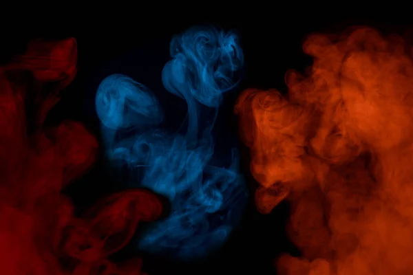 multicolored cigarette vapor blue orange and red exciting patterns on a dark background smoking concept abstraction for design